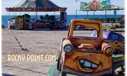 Lonely carnaval ride by the sea.