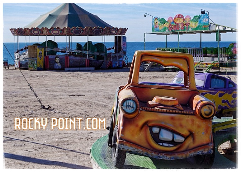 Lonely carnaval ride by the sea.